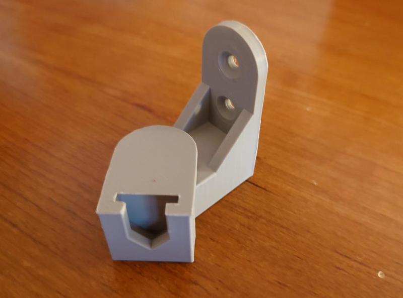 Simple hinged bracket mount for small satellite surround-sound speakers, Vizio