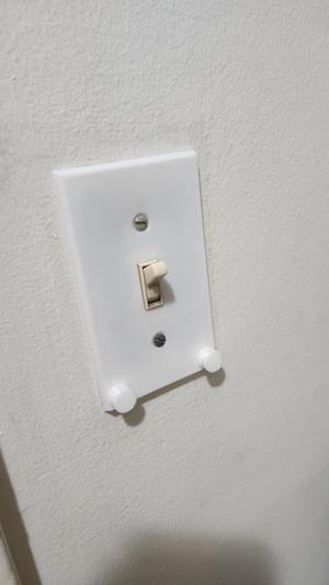 Light switch cover with key hooks