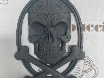 Skull wall hanging with two crossed bones