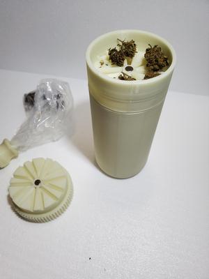 Cannabis grinder bottle.