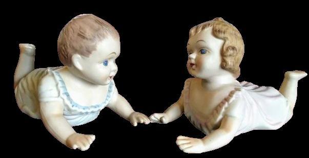 Vintage piano baby statues