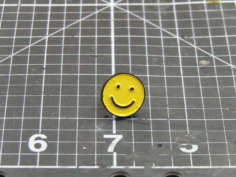 Smiley face enamel pin