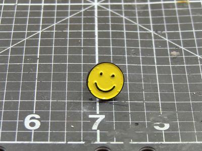 Smiley face enamel pin