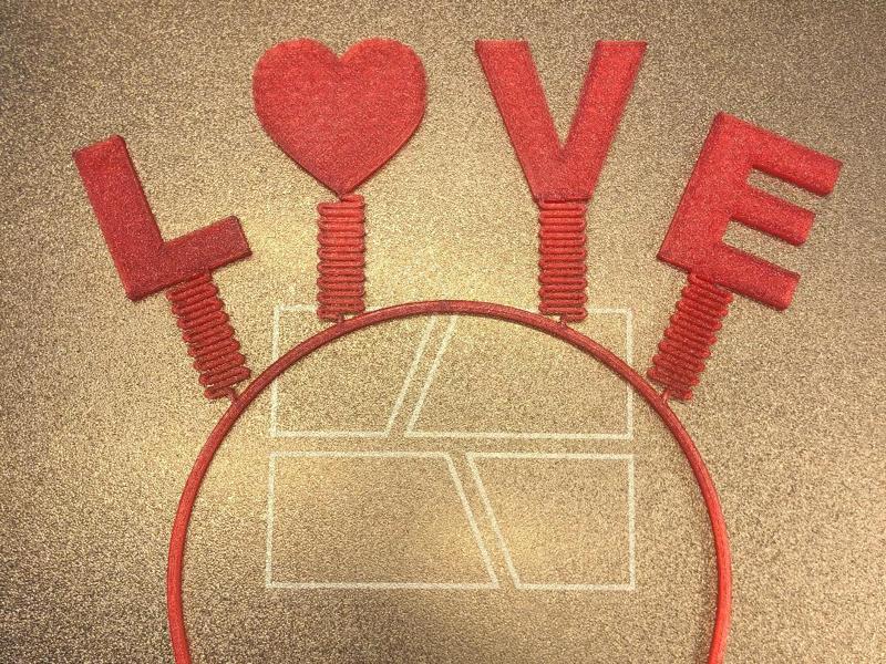 Valentine's Day headband with wobbling symbols