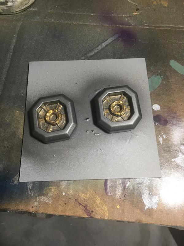 golden greeble on the rifle