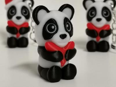 Adorable mini panda with a heart