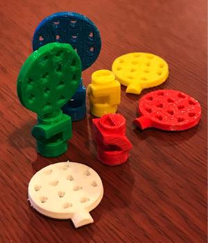 Ravensburger Labyrinth Contest consists of a Yellow, Green, Red, and Blue Players.