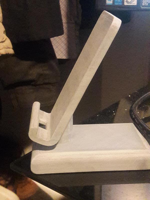 Phone stand with charing port