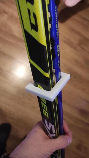 Holder for two hockey sticks