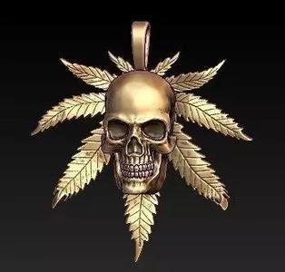 rasta gold skull pendant with marijuana leaves