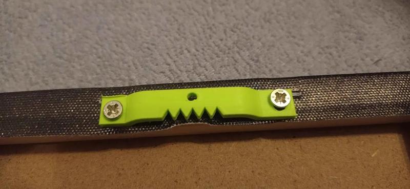 Picture frame hanger with hole for cord   