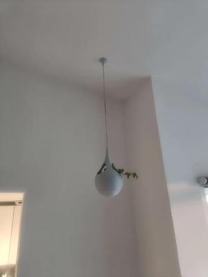 A one-of-a-kind multi hole hanging pot   