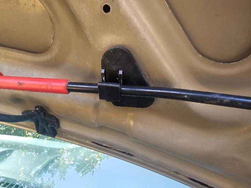Nissan Micra hood prop rod holder   