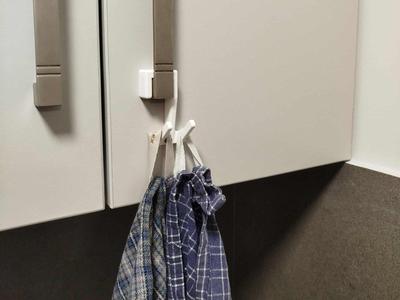 Wiping cloth hanger for cabinet door