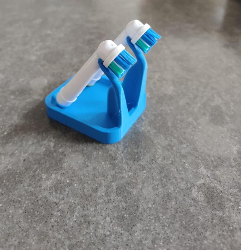 Toothbrush head holder