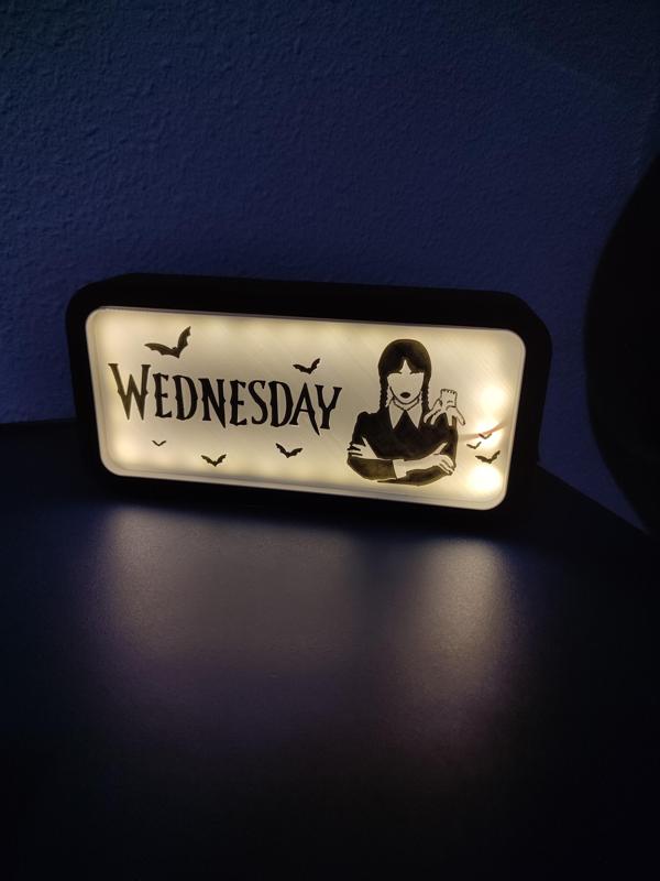 Illuminated sign Wednesday