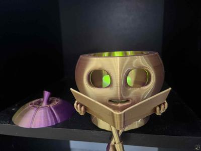 Pumpkin reading a book tealight lantern