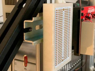 A vertical din rail mount for an Adafruit perma proto board