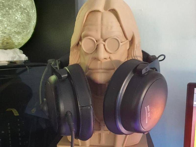 Ozzy with iconic cross headphone hanger (Rip)