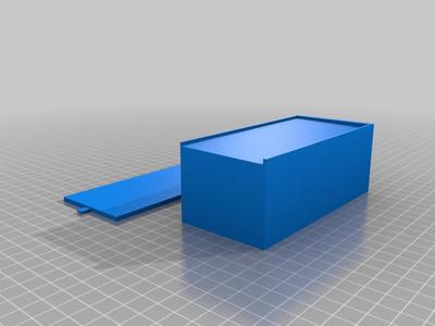 Box with sliding door and hole.