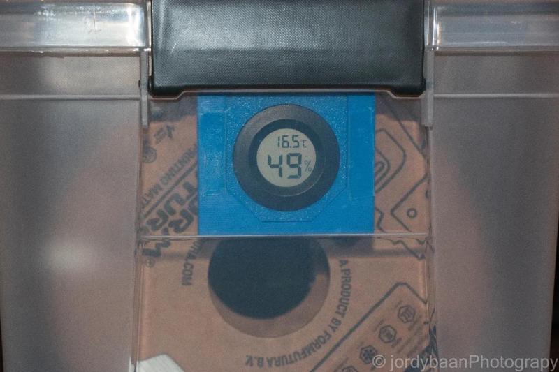 Hygrometer holder for storage box   