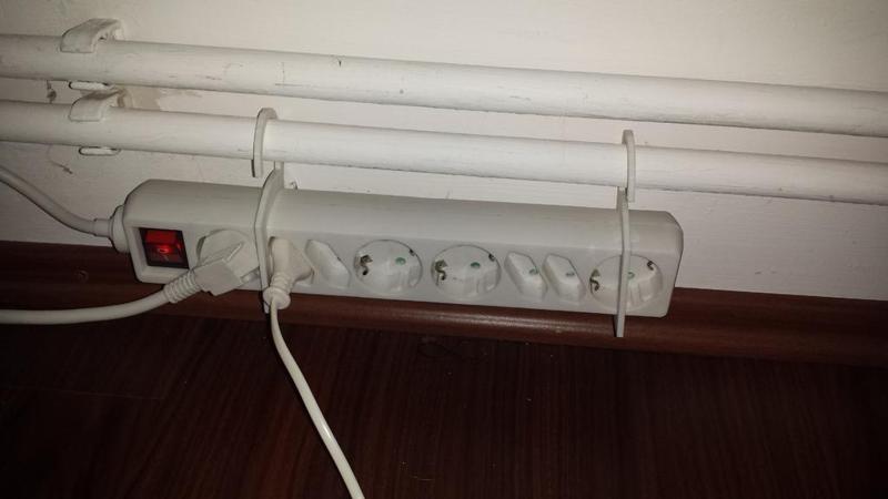 Power strip hooked bracket