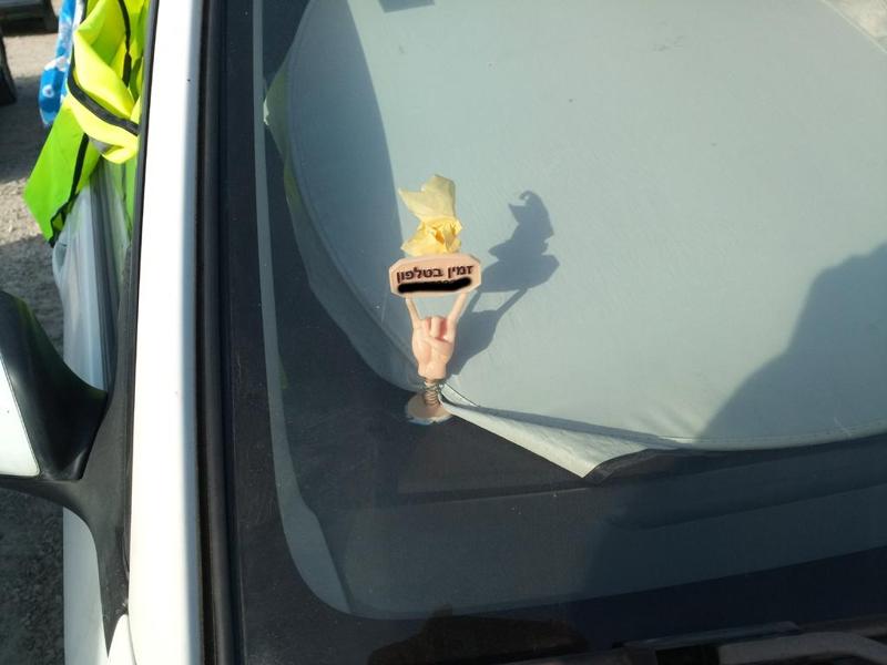 Hand on spring with sign