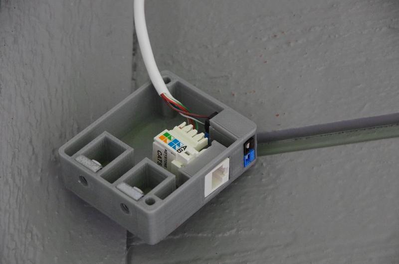 Surface-mount wall box for one keystone ethernet jack and one pair of PowerPoles, with side-mounting captive nuts