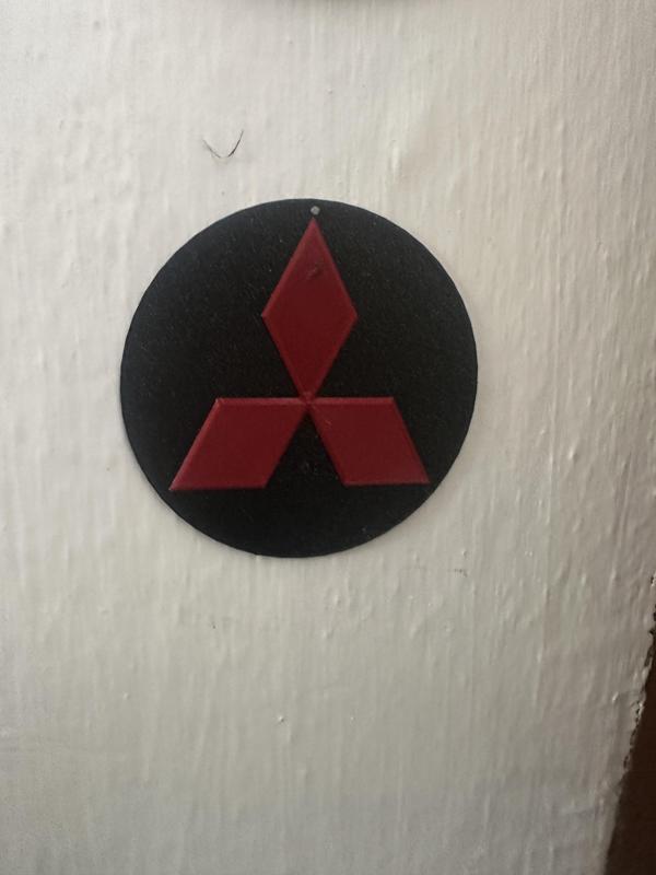 Mitsbishi logo on the wall