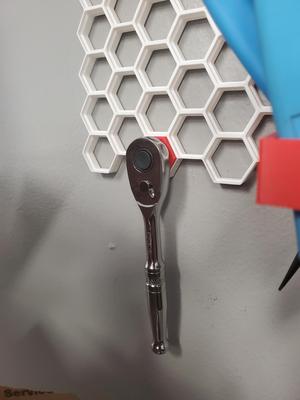 Quarter inch drive ratchet holder for Honeycomb wall