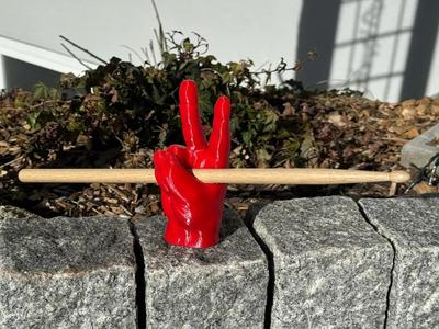 Peace hand drumstick holder