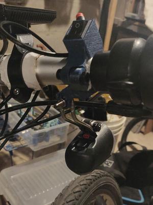 Ebike light mount with switch enclosure