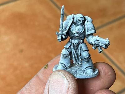 miniature figurine war hammer sword and pistol