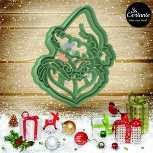 CUTTER OF COOKIES MERRY CHRISTMAS