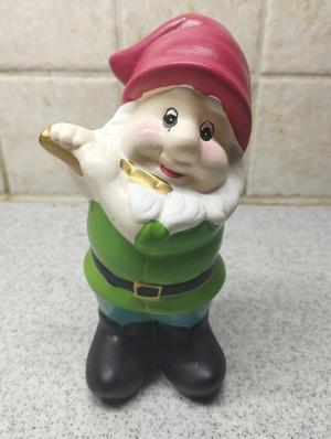 Garden gnome with flute