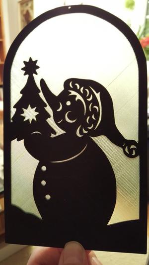 Snowman with tree