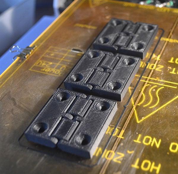 Reversable hinge with screw holes