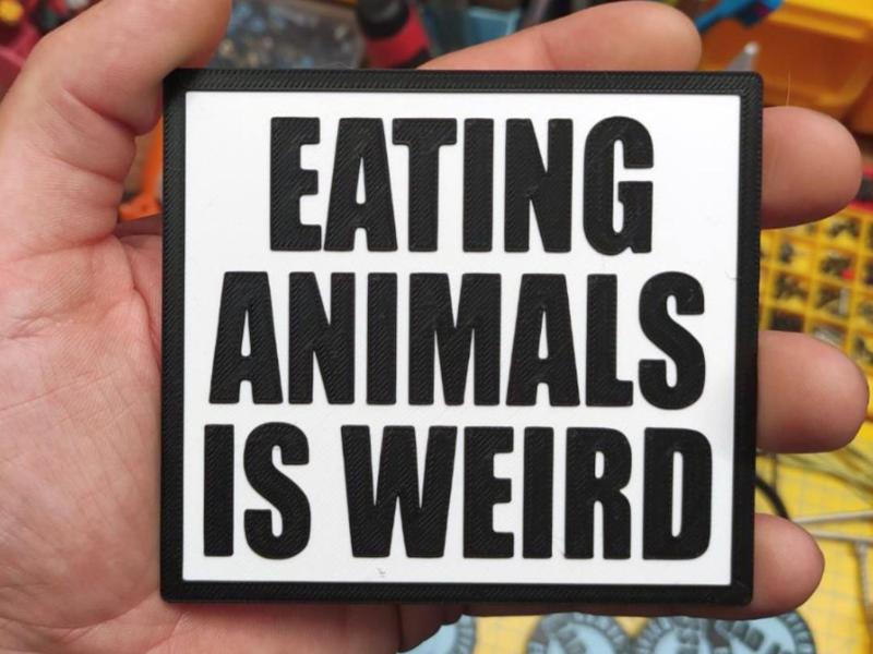 Eating animals is weird - vegan sign