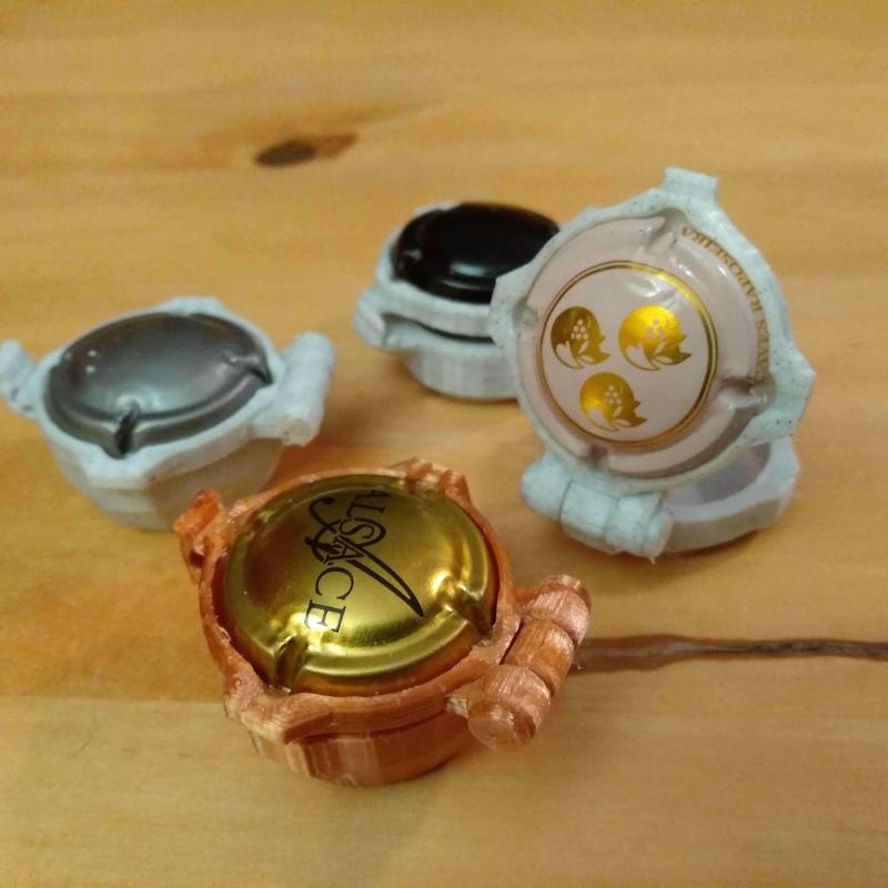 Small boxes using a champagne cap as a lid