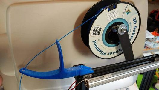 Dual arm filament guide