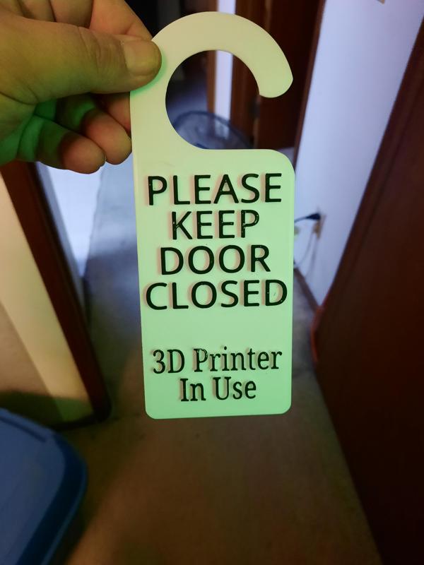 Printing in progress door hanger