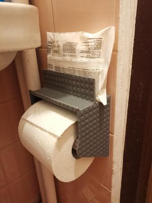Toilet paper holder with compartments for wipes and phone