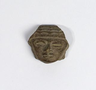 Stone head of a figurine