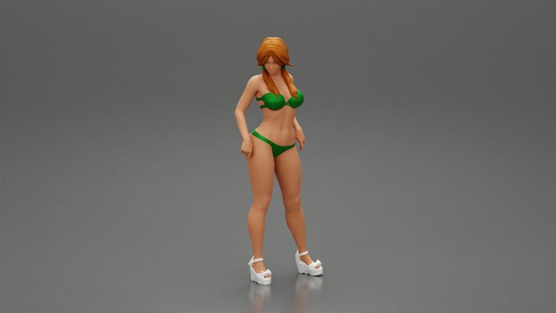 sexy girl in bikini and heels posing standing on the beach