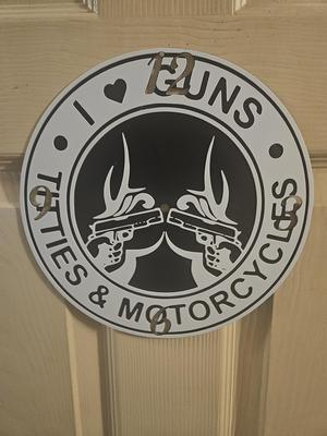 Guns TT's and Motocycles Sign