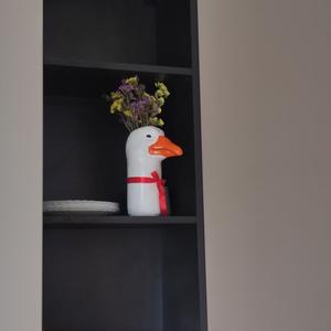 Vase in the shape of a goose's head.