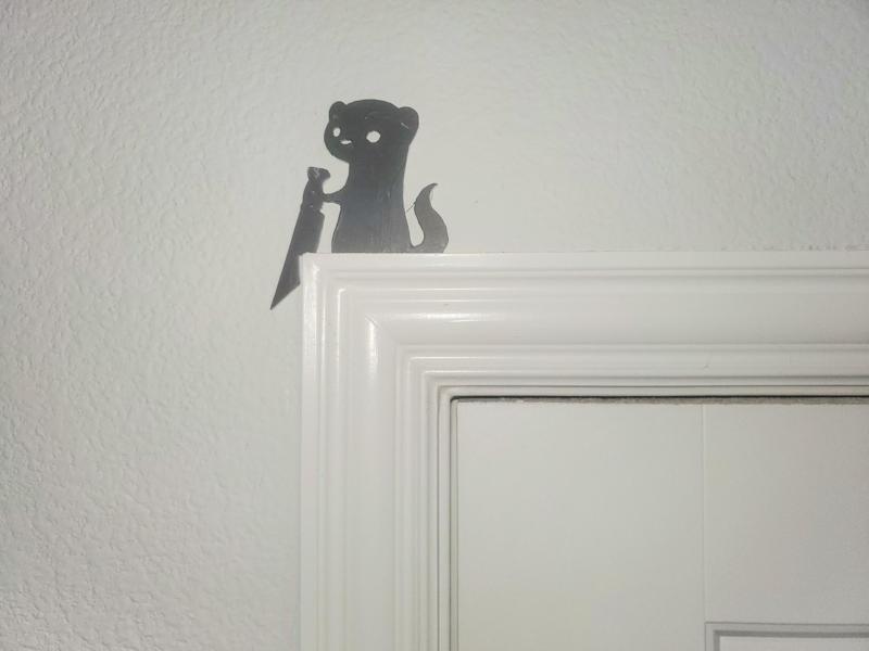 Stabbing Ferret Door Topper