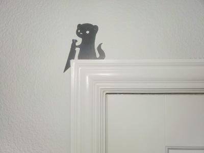 Stabbing Ferret Door Topper
