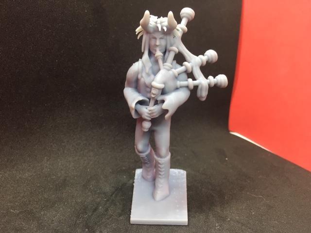 A Tiefling Bard playing bagpipes and viol.