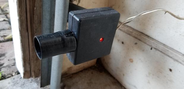 Garage door sensor sun shield